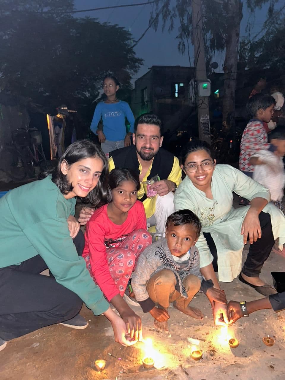 Lighting diyas with the kids at Diwali